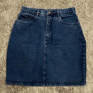 Vintage Women’s high-waist jean skirt, dark wash with small back slit.